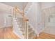 Grand foyer with hardwood floors, staircase, and views of the front door and living spaces at 5003 Village Terrace Dr, Dunwoody, GA 30338