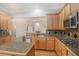 Spacious kitchen with stainless appliances, granite countertops, and an island at 5003 Village Terrace Dr, Dunwoody, GA 30338