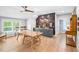 Large dining room featuring a wooden table and a decorative brick wall with a bar and cabinets at 8175 Main St, Woodstock, GA 30188
