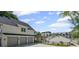 This home boasts a fenced in backyard, outdoor kitchen and an oversized three-car garage at 8175 Main St, Woodstock, GA 30188