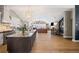 Spacious kitchen with marble countertops, island, and stainless steel appliances flows into dining and living spaces at 8175 Main St, Woodstock, GA 30188