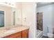 Bathroom featuring a granite countertop, and a shower-tub combo with decorative tile surround at 1024 Stone Mill Run, Lawrenceville, GA 30046