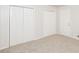Comfortable bedroom featuring new carpet, a closet, and neutral walls at 1024 Stone Mill Run, Lawrenceville, GA 30046