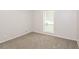 Bright bedroom featuring new carpet, neutral walls and large window at 1024 Stone Mill Run, Lawrenceville, GA 30046
