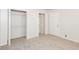 Bedroom featuring new carpet, closet with shelving and a door to hallway at 1024 Stone Mill Run, Lawrenceville, GA 30046