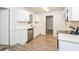 Updated kitchen showcasing stainless steel appliances and wood-look flooring at 1024 Stone Mill Run, Lawrenceville, GA 30046