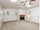 Inviting living room with a fireplace, new carpet, and natural light from windows at 1024 Stone Mill Run, Lawrenceville, GA 30046