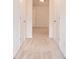 Bedroom featuring neutral walls and carpet flooring, with a window at the far end of the hall at 126 Wellbrook Ne Ct, Conyers, GA 30012