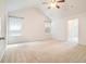 Spacious bedroom with vaulted ceiling, neutral carpet, and ample natural light at 126 Wellbrook Ne Ct, Conyers, GA 30012