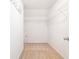 Walk-in closet with shelving, rod and carpet at 126 Wellbrook Ne Ct, Conyers, GA 30012