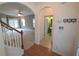 Open entryway with staircase, arched doorways leading to a bathroom and living room at 126 Wellbrook Ne Ct, Conyers, GA 30012