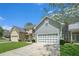 Charming two-story home featuring a well-maintained lawn, a two-car garage, and stylish gray siding at 126 Wellbrook Ne Ct, Conyers, GA 30012