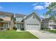 Charming two-story home featuring a well-manicured lawn and attached garage, perfect for suburban living at 126 Wellbrook Ne Ct, Conyers, GA 30012