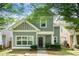 Charming two-story home with shaker siding, tidy landscaping, and sidewalk leading to the front door at 126 Wellbrook Ne Ct, Conyers, GA 30012