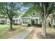 Two story home with shaker siding and covered porch with sidewalk leading to front door at 126 Wellbrook Ne Ct, Conyers, GA 30012