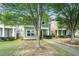 Two story home with shaker siding and covered porch with sidewalk leading to front door at 126 Wellbrook Ne Ct, Conyers, GA 30012