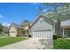 Attractive townhome with a two-car garage and well-maintained lawn at 126 Wellbrook Ne Ct, Conyers, GA 30012