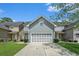 Charming townhome with a two-car garage, well-maintained lawn, and beautiful landscaping at 126 Wellbrook Ne Ct, Conyers, GA 30012