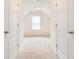Hallway view to large bedroom with neutral carpeting and bright, natural light at 126 Wellbrook Ne Ct, Conyers, GA 30012