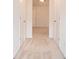 Hallway to large bedroom with neutral carpeting and bright, natural light at 126 Wellbrook Ne Ct, Conyers, GA 30012