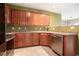 Kitchen features wooden cabinetry, stainless steel appliances, and neutral countertops at 126 Wellbrook Ne Ct, Conyers, GA 30012