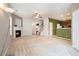 Spacious living room with fireplace and lots of natural light open to kitchen and entrance at 126 Wellbrook Ne Ct, Conyers, GA 30012