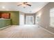 Spacious living room with plush carpeting, neutral walls, and french doors leading to the outside at 126 Wellbrook Ne Ct, Conyers, GA 30012
