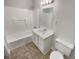 This bathroom features a tub and a single sink vanity at 1480 Pine Log Ne Rd # D, Conyers, GA 30012