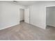 This bedroom features neutral carpet and a walk-in closet at 1480 Pine Log Ne Rd # D, Conyers, GA 30012