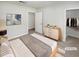 This bedroom features neutral colors and a walk-in closet at 1480 Pine Log Ne Rd # D, Conyers, GA 30012