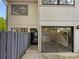 Two-story townhome with a fenced front yard and sliding glass door at 1480 Pine Log Ne Rd # D, Conyers, GA 30012