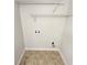 This laundry room features tile floors and connections for a washer and dryer at 1480 Pine Log Ne Rd # D, Conyers, GA 30012