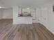 This living room features hardwood floors and an open concept to the kitchen at 1480 Pine Log Ne Rd # D, Conyers, GA 30012