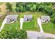 Aerial view of three homes and a well manicured neighborhood at 3012 Flat Shoals Rd, Conyers, GA 30094