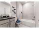 Elegant bathroom with a modern vanity, bathtub, shower, and unique toilet seat cover at 3012 Flat Shoals Rd, Conyers, GA 30094