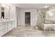 Spacious bathroom with double vanity, glass shower, and a walk-in closet at 3012 Flat Shoals Rd, Conyers, GA 30094