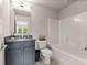 Bathroom featuring a shower-tub combo, neutral walls, and a modern vanity with gray countertop at 3012 Flat Shoals Rd, Conyers, GA 30094
