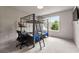 Bunkbed bedroom with basketball hoop and desk overlooking backyard at 3012 Flat Shoals Rd, Conyers, GA 30094
