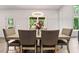 Cozy dining area with a wooden table, stylish chairs, and a view of the outdoors at 3012 Flat Shoals Rd, Conyers, GA 30094