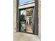 Inviting foyer with a modern glass door, open staircase, and sleek hardwood floors at 3012 Flat Shoals Rd, Conyers, GA 30094