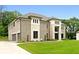 Gorgeous two-story home featuring a three-car garage, brick facade, and lush green lawn at 3012 Flat Shoals Rd, Conyers, GA 30094