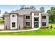 Beautiful brick home featuring an inviting front lawn with vibrant flower beds and a stylish entrance at 3012 Flat Shoals Rd, Conyers, GA 30094