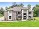 Stunning exterior of a brick home with a manicured lawn and a stone entryway, creating a welcoming curb appeal at 3012 Flat Shoals Rd, Conyers, GA 30094