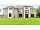 Charming brick home featuring a well-manicured lawn and a modern front door at 3012 Flat Shoals Rd, Conyers, GA 30094