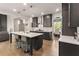 Modern kitchen features dark cabinetry, stainless appliances, and island with seating at 3012 Flat Shoals Rd, Conyers, GA 30094