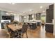 Modern kitchen and dining area with dark cabinets and island with counter seating at 3012 Flat Shoals Rd, Conyers, GA 30094