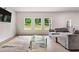 Bright living room with large windows, gray sofa and a modern glass coffee table at 3012 Flat Shoals Rd, Conyers, GA 30094