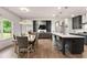 Open concept kitchen and dining area featuring views to living room with fireplace at 3012 Flat Shoals Rd, Conyers, GA 30094