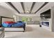 Expansive main bedroom with a beamed ceiling, fireplace, and sitting area at 3012 Flat Shoals Rd, Conyers, GA 30094