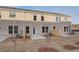 Townhome backyard features a patio and sparse grass, with privacy fencing between units at 340 Heavenly Hollow Pl, Mcdonough, GA 30253